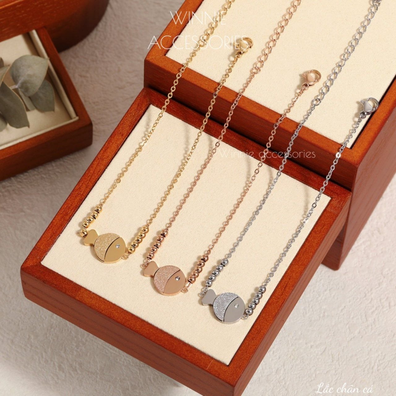  Lắc chân titan Cá 