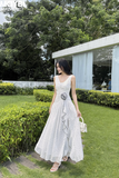 Đầm xòe cổ V xẻ tà dáng maxi