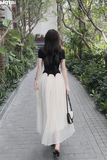 Đầm thun ôm đen tay ngắn tùng xòe dáng maxi