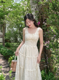 Đầm hai dây cotton thêu kem nhún xòe dáng maxi