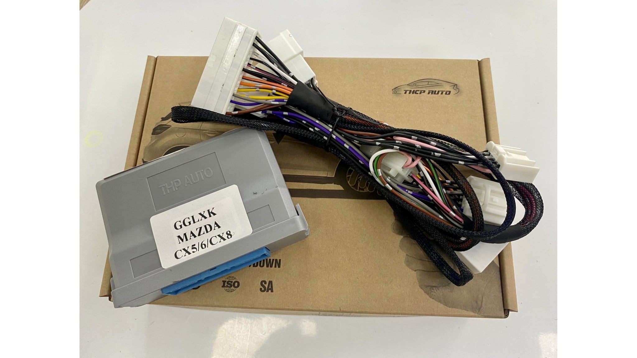 Modul GGLXK Mazda CX5/6/CX8 và bó dây trên hộp sản phẩm THP