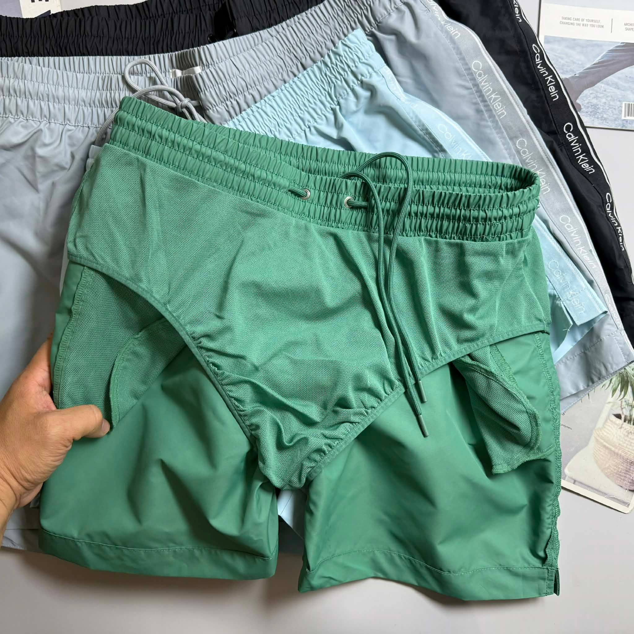 QUẦN BƠI C.K VẢI GIÓ LÓT LƯỚI 7157