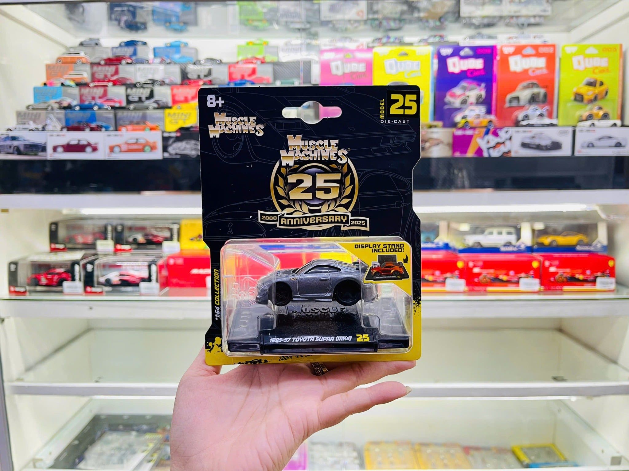  Mô hình xe Toyota Supra (MK4) 1995-97 grey 25th Anniversary - Muscle Machines bản card tỉ lệ 1:64 Maisto 15536 