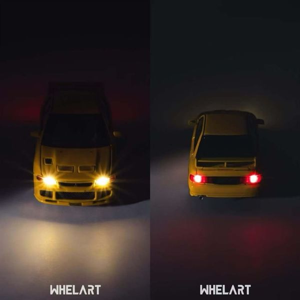  Mô hình xe Mitsubisbi Evo3 Yellow (Lighting Function) tỉ lệ 1:64 Whelart H-0034 
