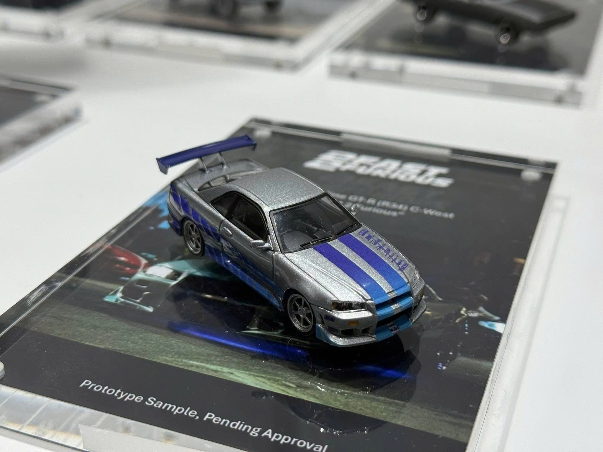  Mô hình xe Nissan Skyline GT-R C-West “2 Fast 2 Furious” Brian O’Conner bản card tỉ lệ 1:64 MiniGT MGT01252 