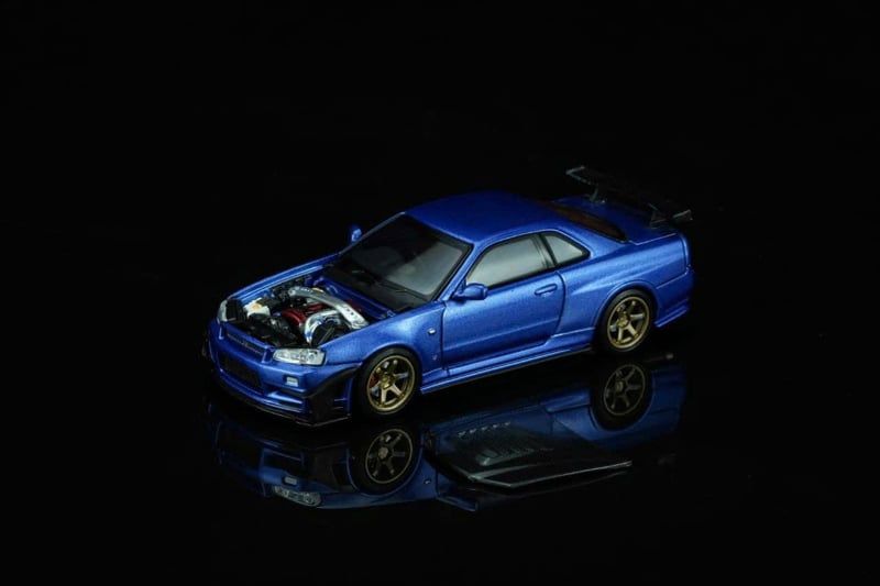  Mô hình xe Nissan Skyline GT-R (R34) Customized Bayside Blue w Diecast Model tỉ lệ 1:64 MOTORHELIX M63476 