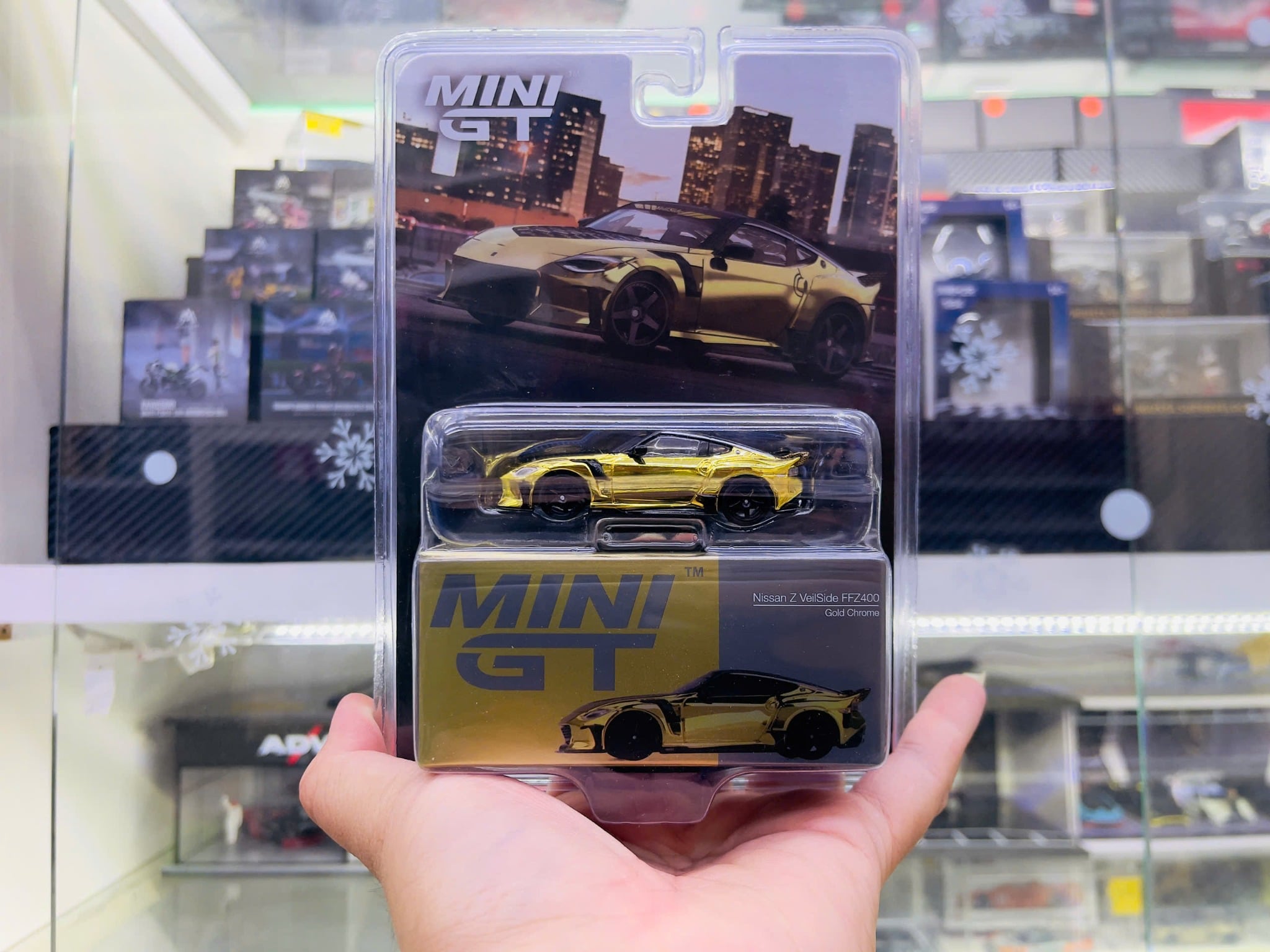  Mô hình xe Nissan Z VeilSide FFZ400 Gold Chrome tỉ lệ 1:64 MiniGT MGT00985-BL 
