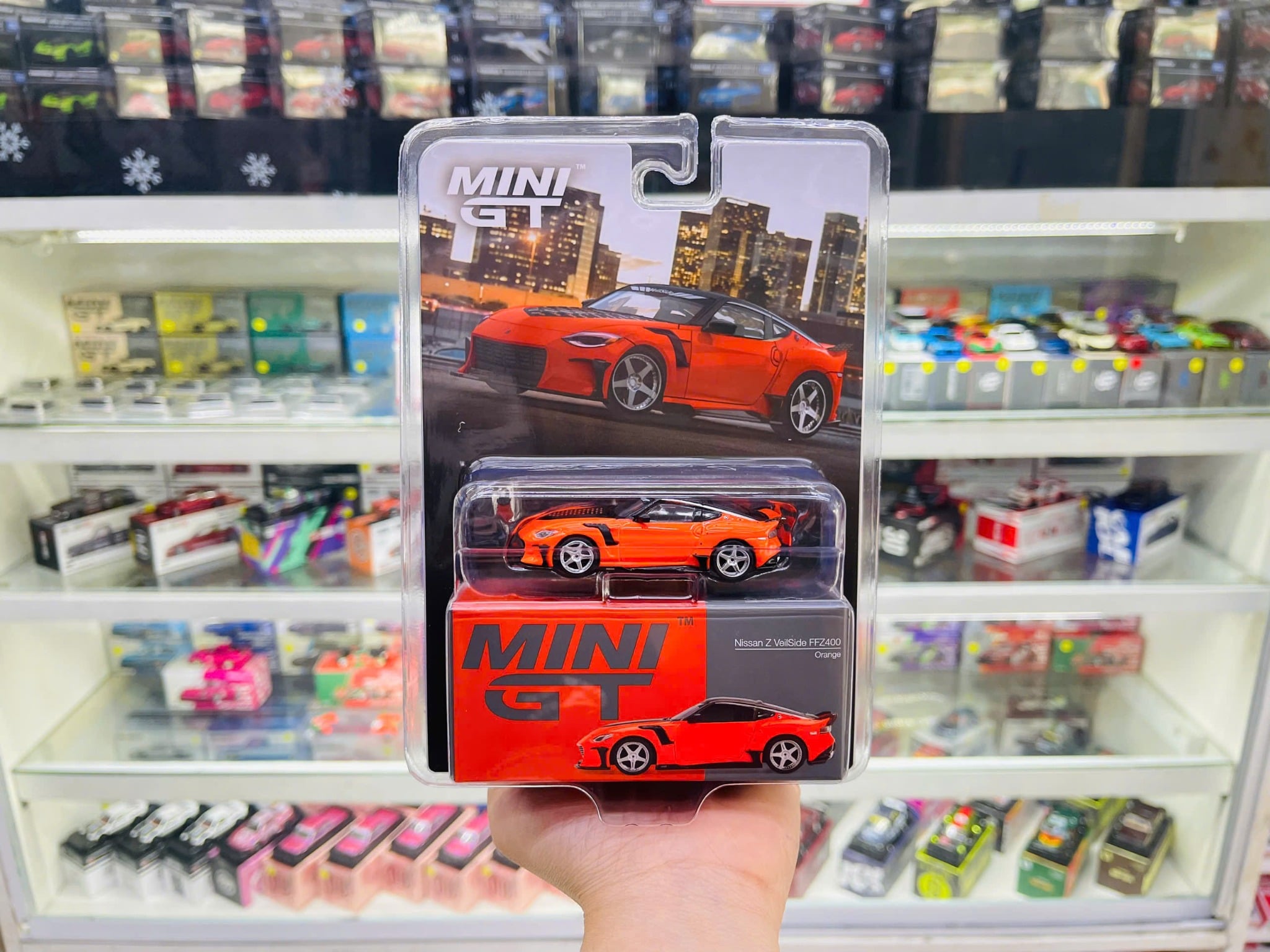  Mô hình xe Nissan Z VeilSide FFZ400 Orange bản card tỉ lệ 1:64 MiniGT MGT00989 