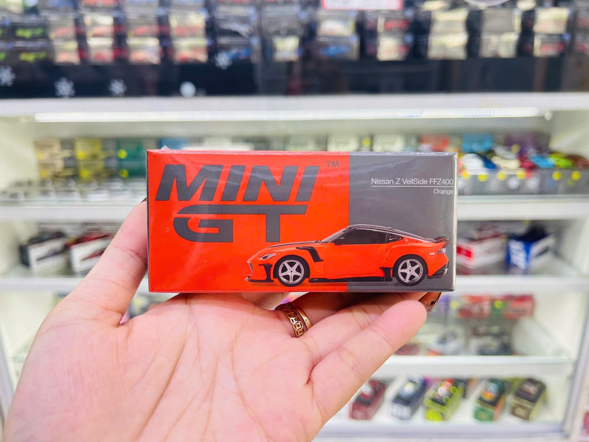  Mô hình xe Nissan Z VeilSide FFZ400 Orange tỉ lệ 1:64 MiniGT MGT00989 