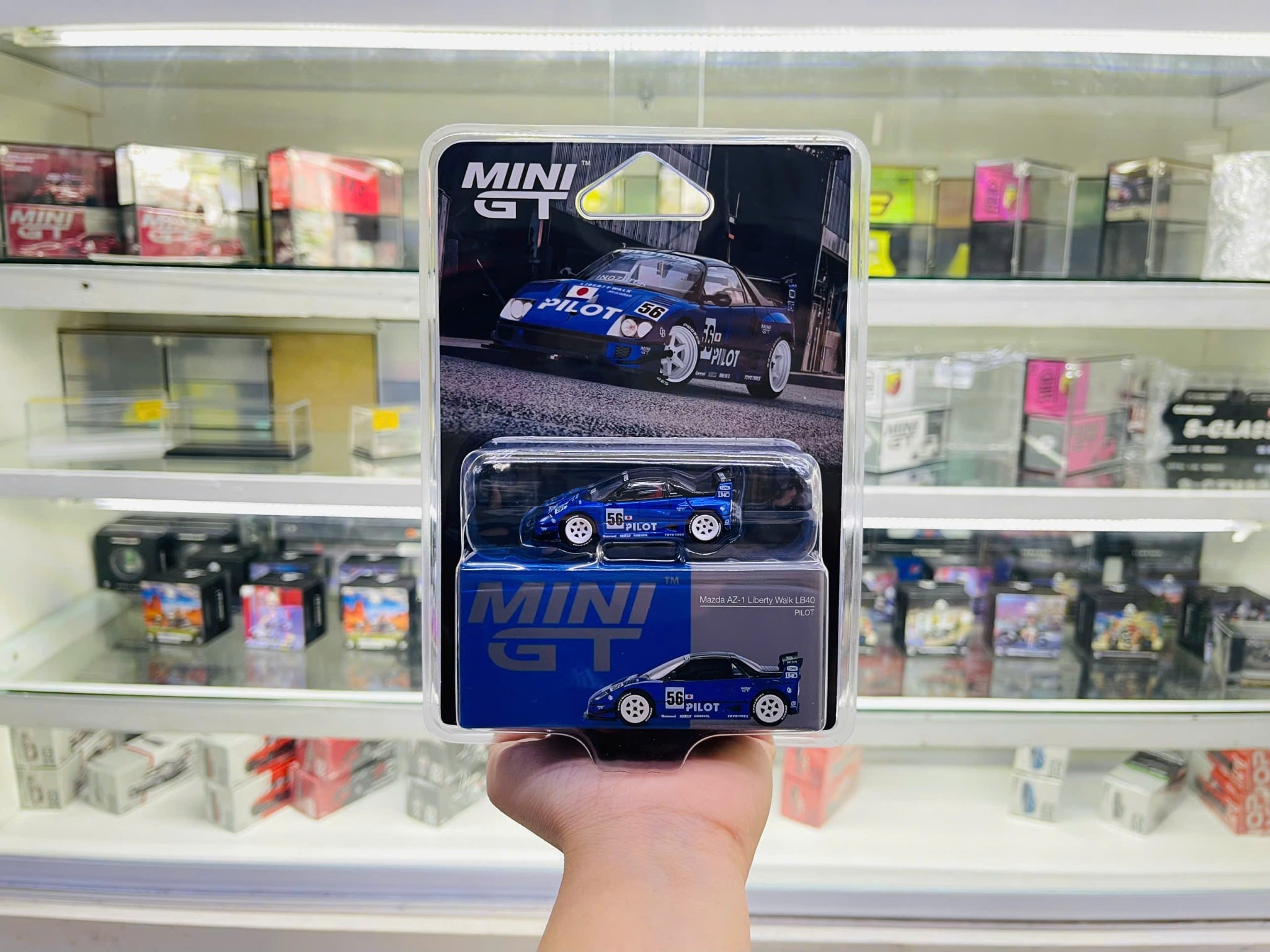  Mô hình xe Mazda AZ-1 Liberty Walk LB40 PILOT card tỉ lệ 1:64 MiniGT MGT01047-BL 