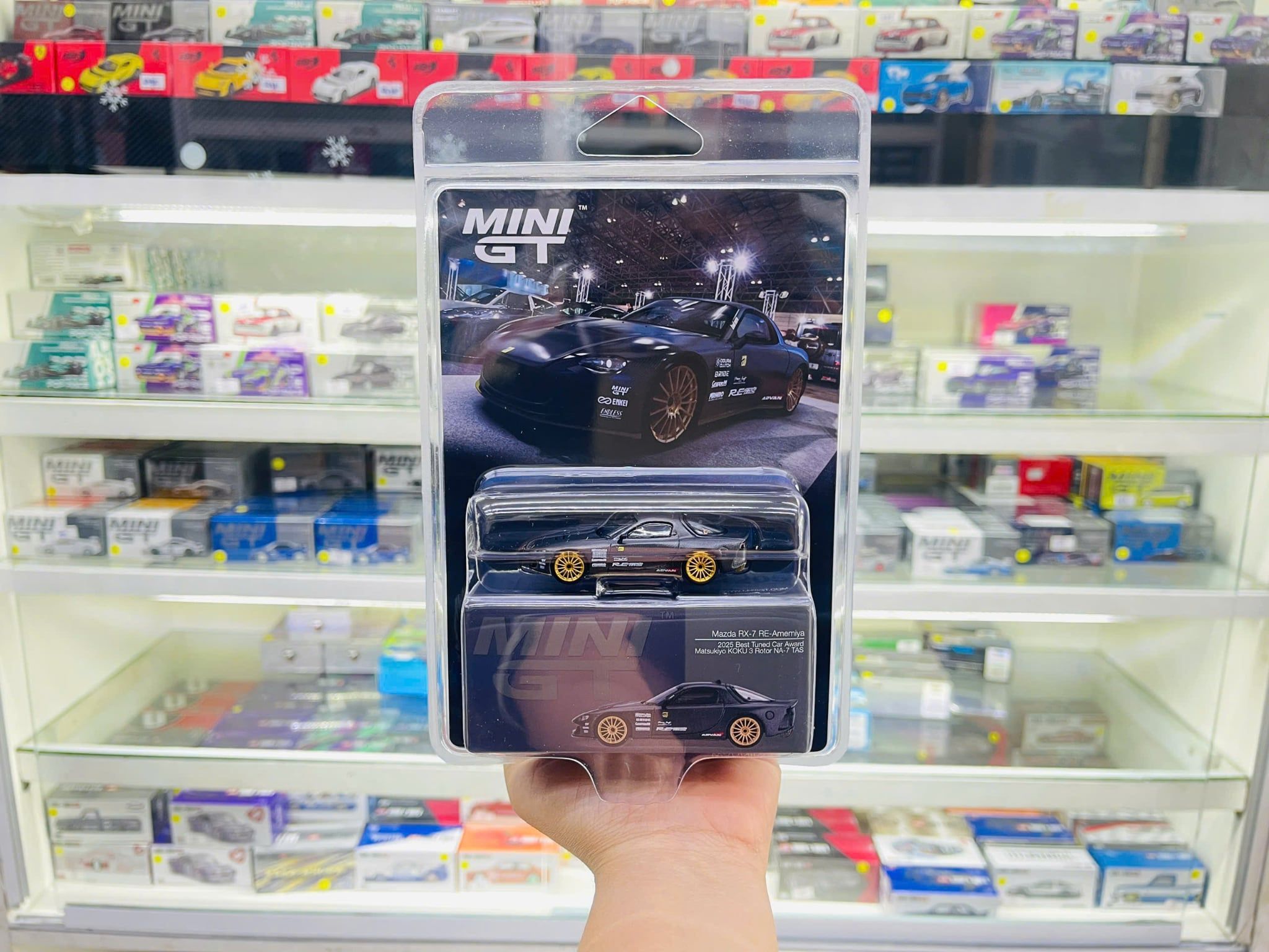  Mô hình xe Mazda RX-7 RE-Amemiya Matsukiyo KOKU 3 Rotor NA-7 TAS 2025 Best Tuned Car Award card tỉ lệ 1:64 MiniGT MGT01205 