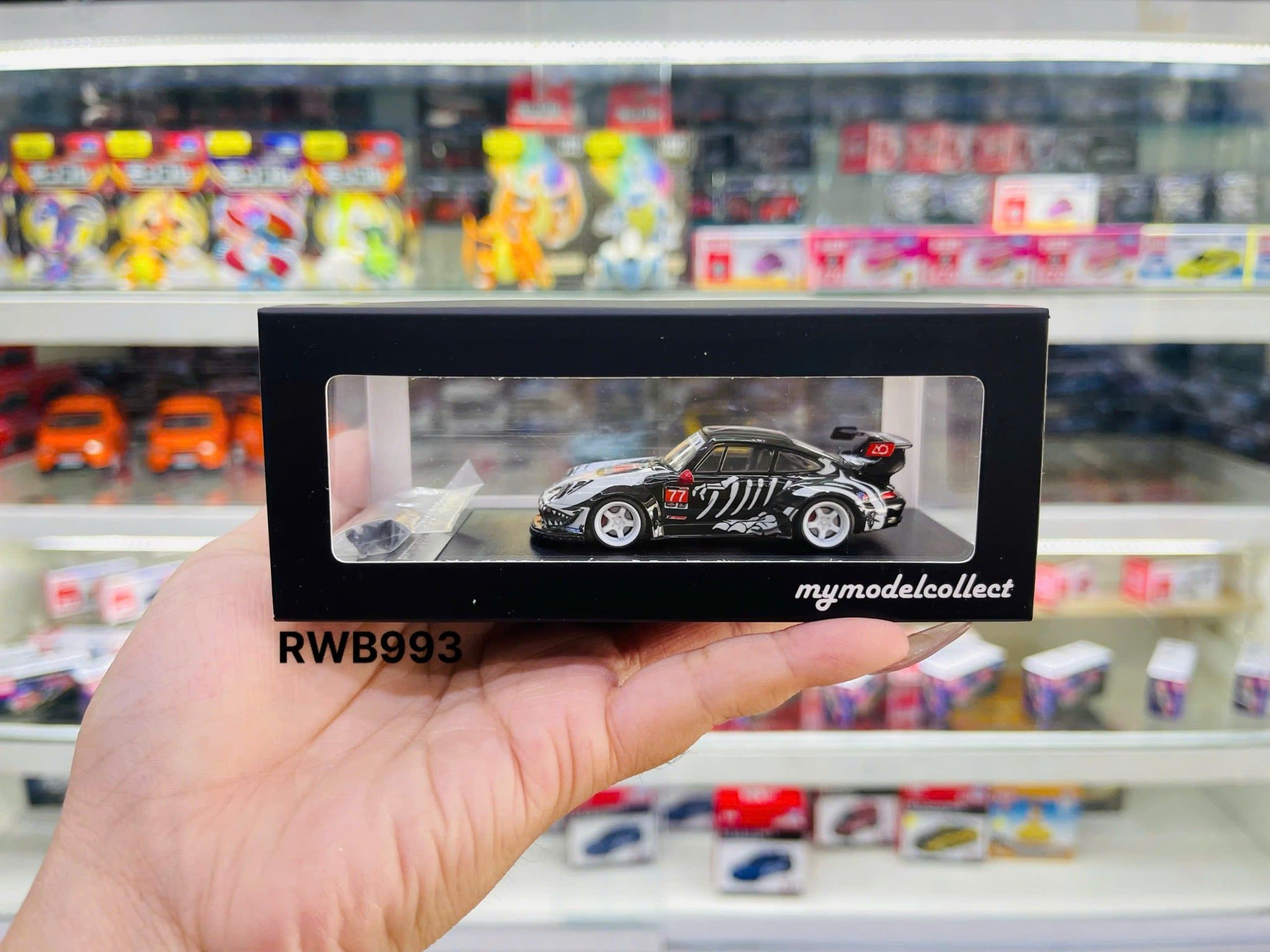  Mô hình xe Porsche RWB993 #77 Skeleton IMSA Petit Le Mans tỉ lệ 1:64 Mymodelcollect OT64743 