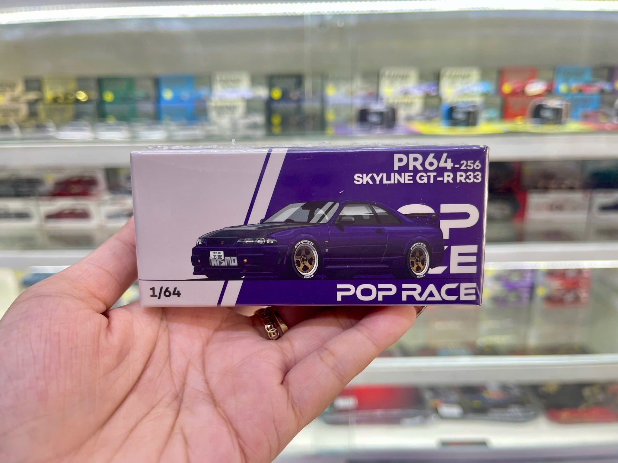  Mô hình xe Nissan skyline GT-R R33 Nismo midnight purple tỉ lệ 1:64 Poprace PR640256 