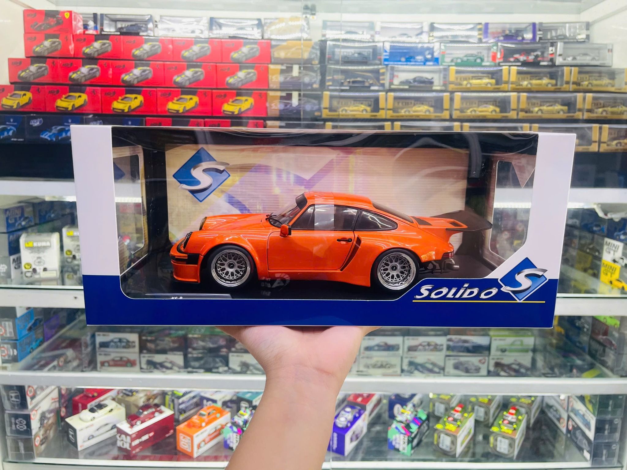  Mô hình xe ô tô Porsche 911 (964) Coupe KS-R 2022 orange tỉ lệ 1:18 Solido model S1810501 