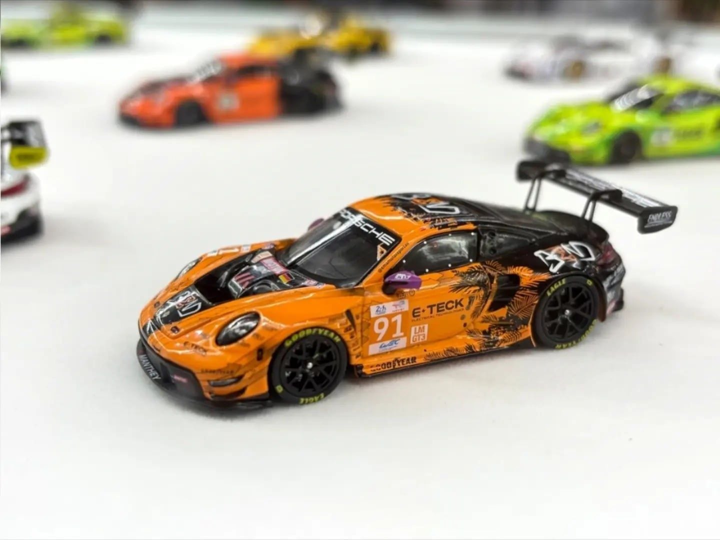  Mô hình xe Porsche 911 GT3 R - EMA Motorsport-2024 LeMans 24H LMGT3 Winner #91 tỉ lệ 1:64 Trends Hobby 241084K 