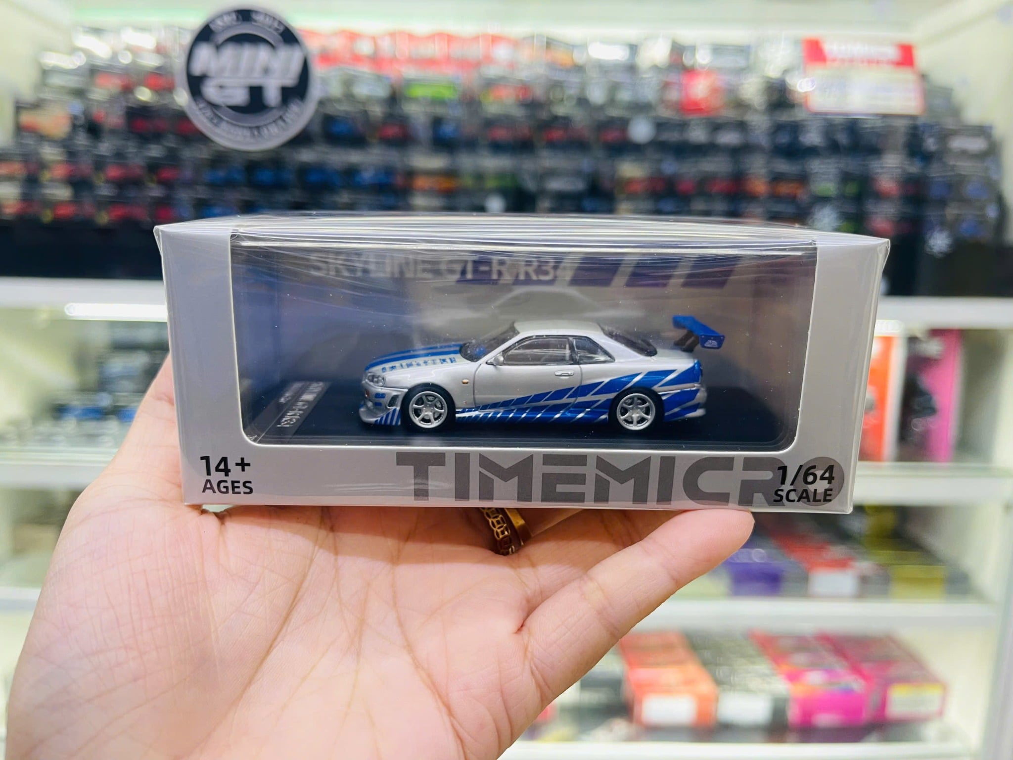  Mô hình xe Skyline GT-R R34 Silver-Blue tỉ lệ 1:64 Time Micro TM800502 