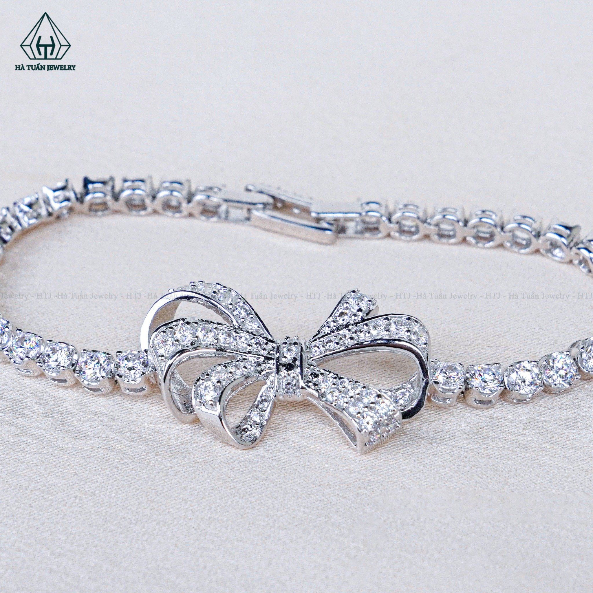  B039 Lắc tay nơ full đá 