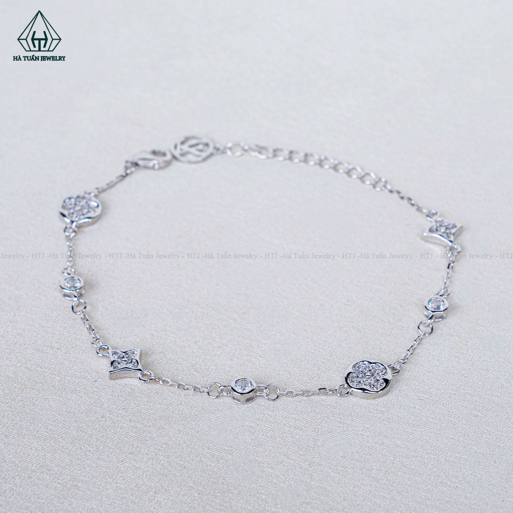  B082 Lắc tay L.V đá 