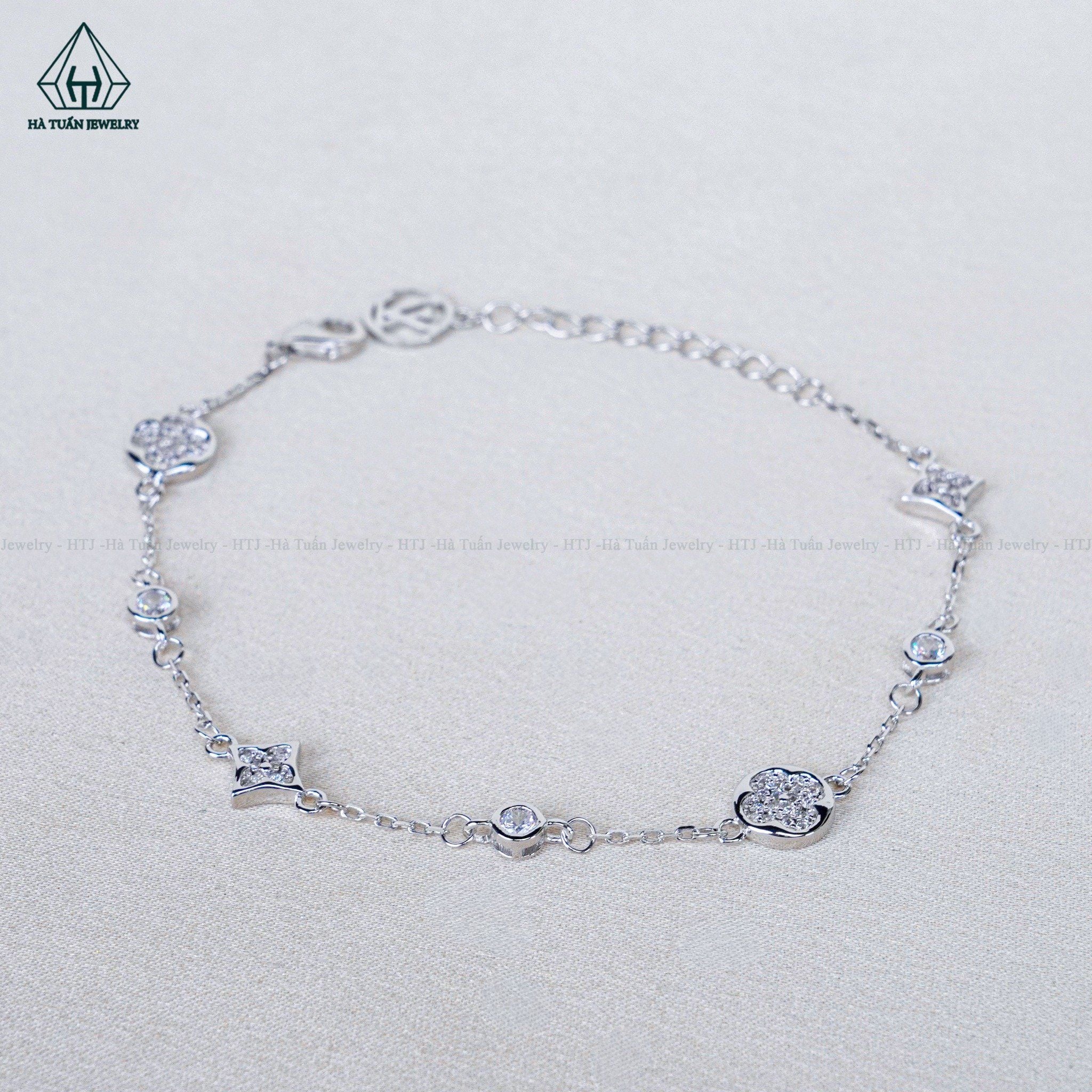  B082 Lắc tay L.V đá 