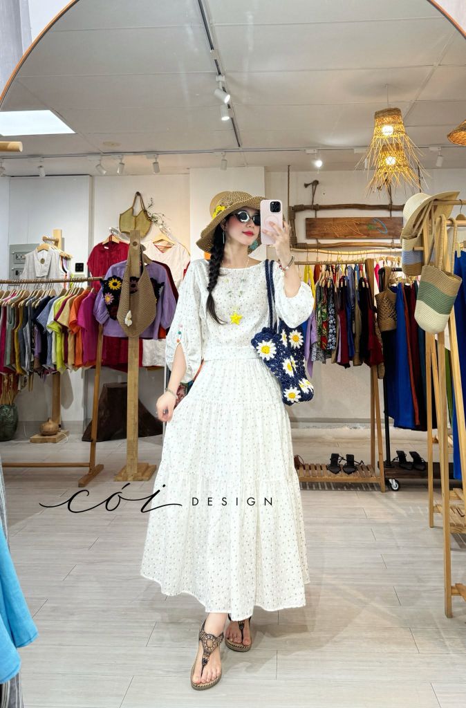 Áo tay phồng phối nơ lưng Chất cotton dobby Cói Design