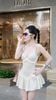 Đầm Thun Len Xòe Kèm Hoa