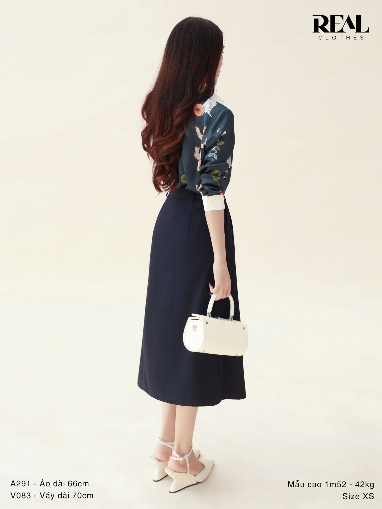 Váy 2 xếp xanh đen