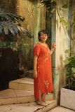  Đầm linen thêu tay Xuyến Chi - Cam Đỏ nút hông 
