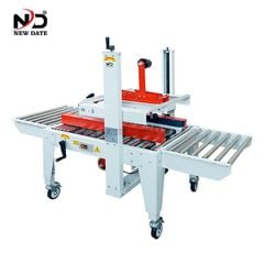 Máy Dán Thùng Carton Tự Động New Date – Giải Pháp Dán Băng Keo Thùng Carton 2 Mặt Cho Dây Chuyền Đóng Gói