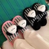  Dép lông charm cún đen trắng kẻ sọc 