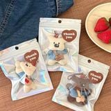  Móc khoá cún dẹt túi xương 