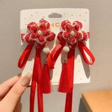  Kẹp tóc hoa đào nhung đỏ dây tua dài 