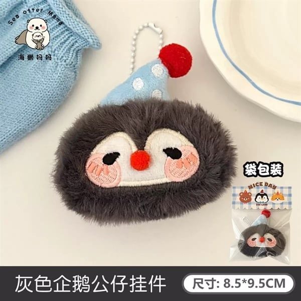  Móc khoá bông cánh cụt mũ chấm bi 