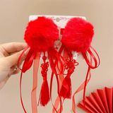  Kẹp tóc bông tròn đỏ dây tua dài 