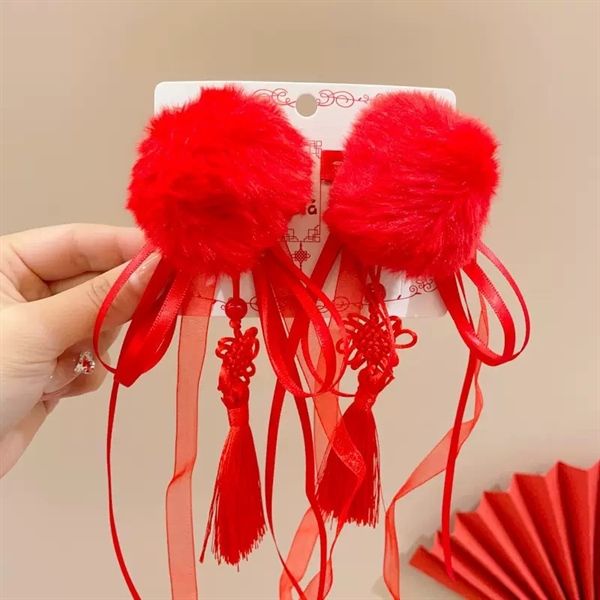  Kẹp tóc bông tròn đỏ dây tua dài 