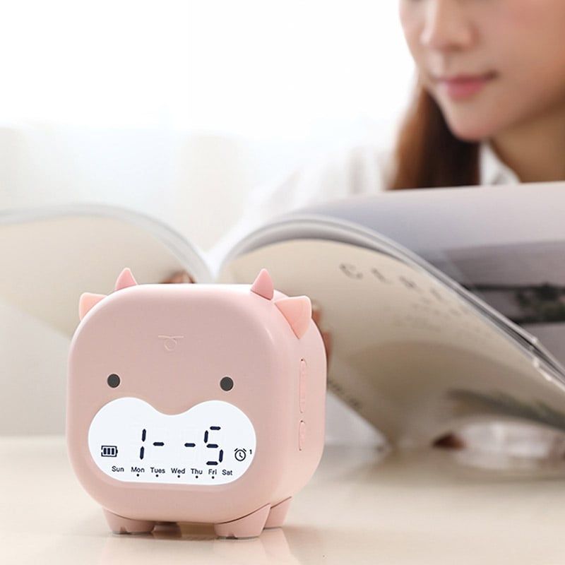 Đồng hồ báo thức hình bò ngố Dada hồng phấn FSLDZ-504
