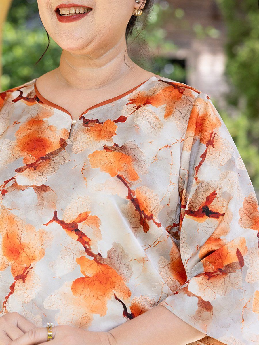  Hạnh - Áo kiểu trung niên cổ xẻ lá trầu đính hạt châu chất liệu lụa in họa tiết 25415/5.400/5.399/5.401 