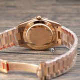 Đồng Hồ Rolex Day-Date 40mm 228235-0003 Rep 1:1 Cao Cấp Vỏ Vàng Hồng Mặt Nâu Cọc Số Đính Đá Baguette Dây Kim Loại