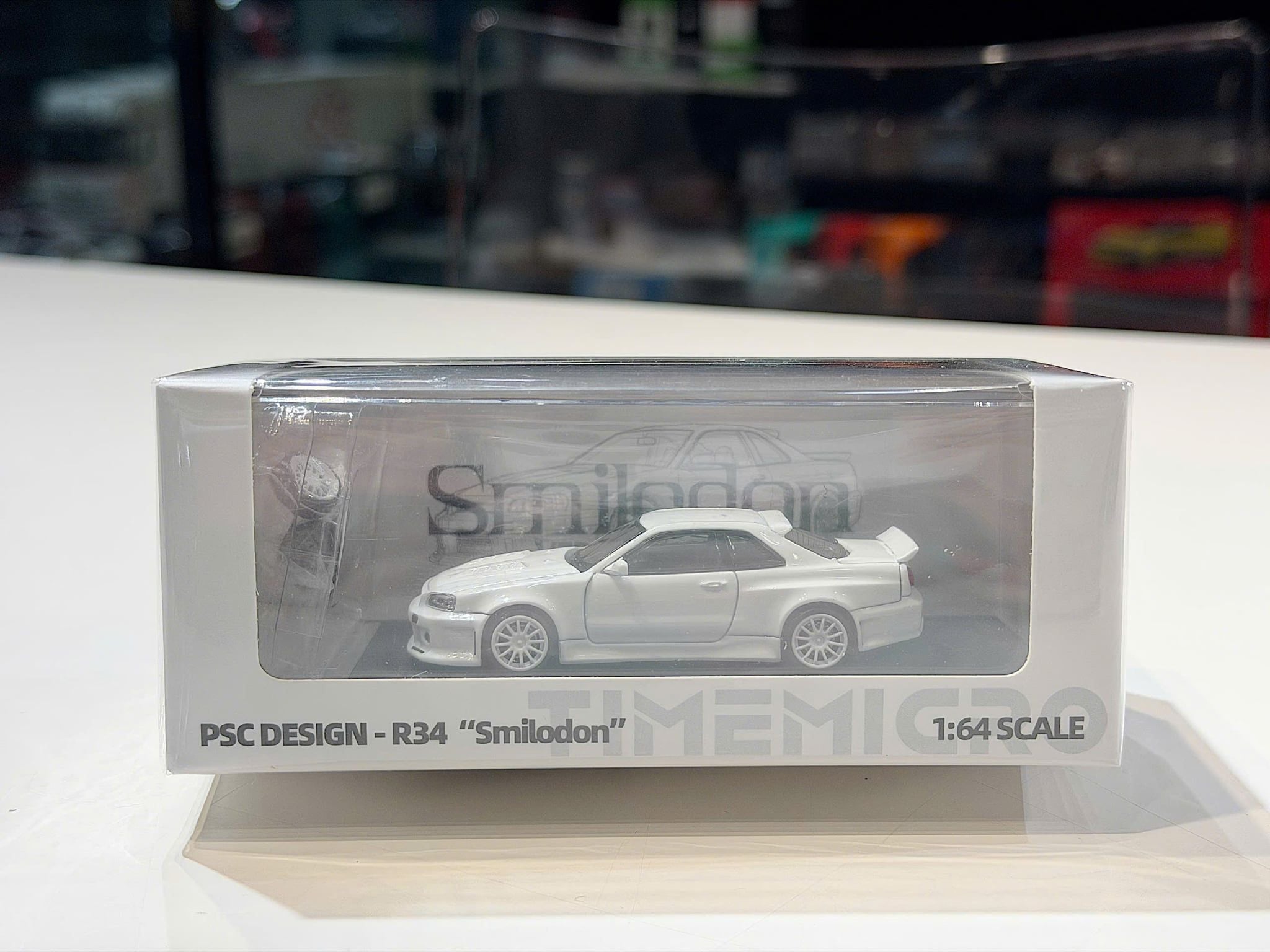 XE MÔ HÌNH NISSAN R34 SMILODON PSC DESIGN,TỶ LỆ 1/64 TIME MICRO