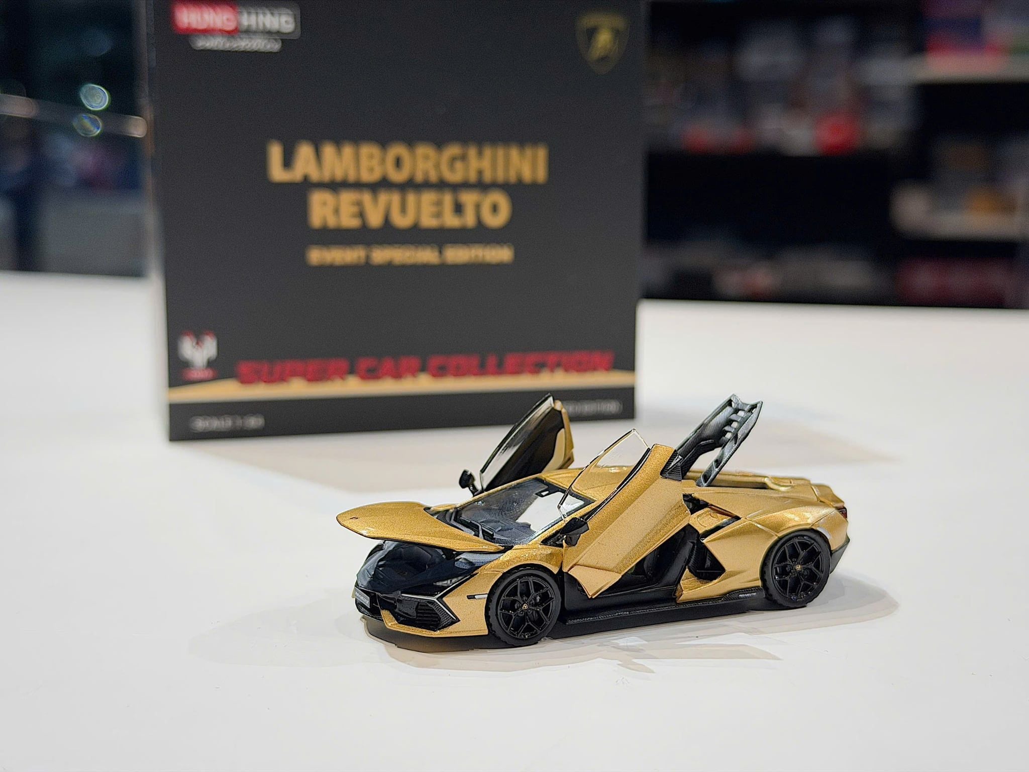XE MÔ HÌNH LAMBORGHINI REVUELTO GOLD,TỶ LỆ 1/64 HUNGHINH