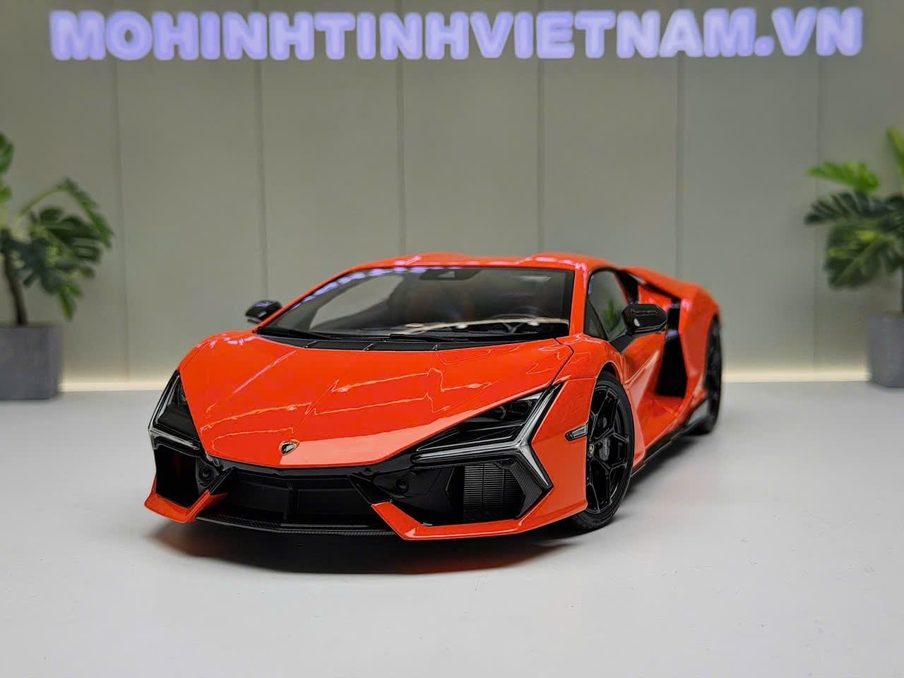 XE MÔ HÌNH LAMBORGHINI REVUELTO ORANGE,TỶ LỆ 1/18 LCD