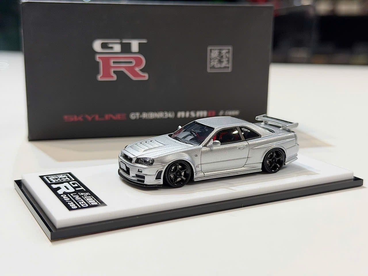 XE MÔ HÌNH NISSAN GT-R R34 SKYLINE NISMO Z-TUNE SILVER,TỶ LỆ 1/64 SACRILEGIOUS AUTO MODEL