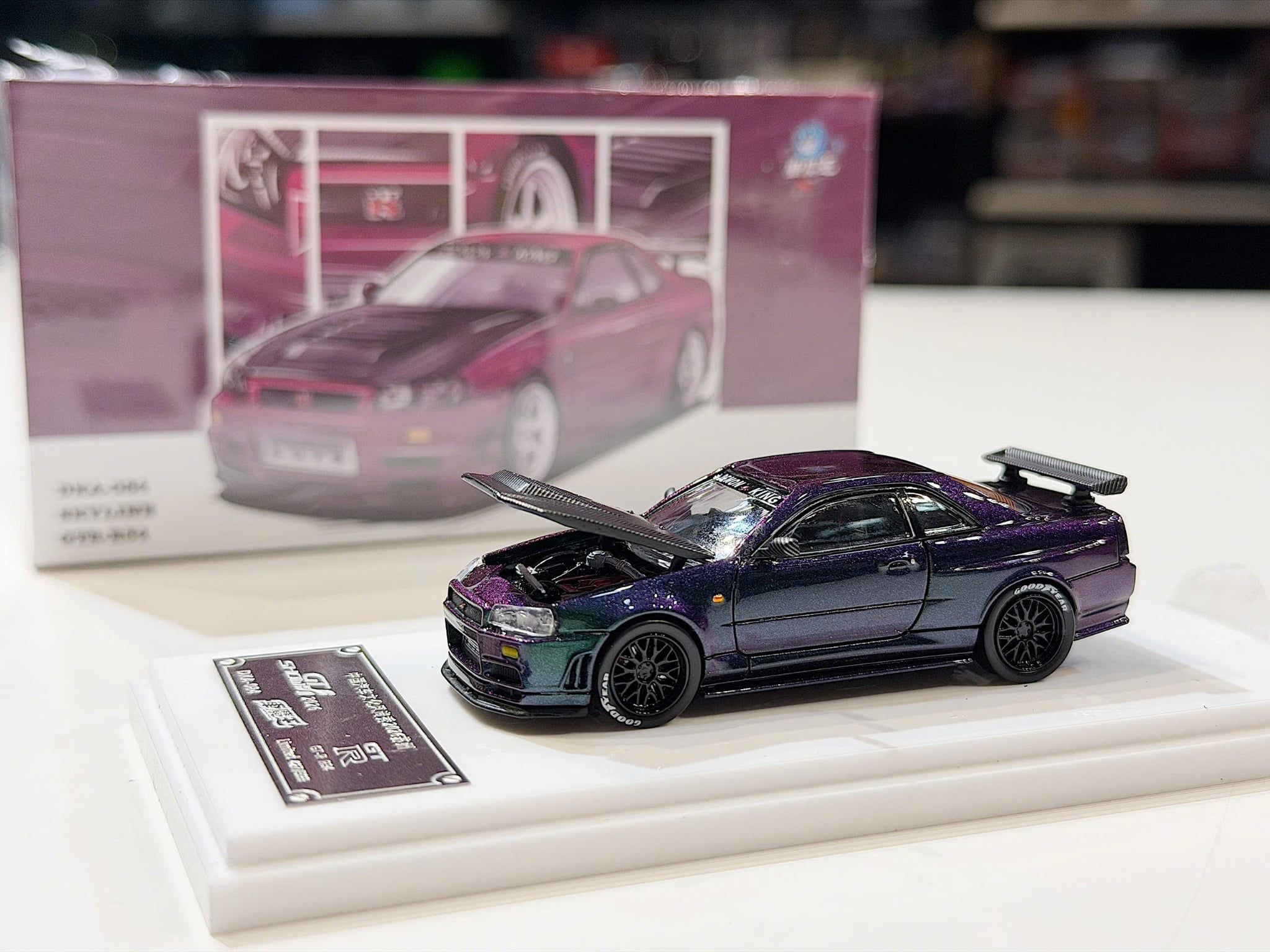 XE MÔ HÌNH NISSAN GT-R R34 SKYLINE CHAMELEON,TỶ LỆ 1/64 DEMON KING