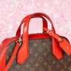 Túi đeo Louis Vuitton Dora MM Monogram Ebene / Red Calfskin