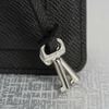 Clutch Louis Vuitton Belaia Noir Taiga size 25