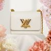Túi đeo Louis Vuitton Twist PM Bronze White