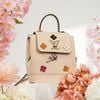 Balo/ Túi đeo Louis Vuitton Creme Calfskin Mechanical Flower Lockme Mini