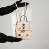 Balo/ Túi đeo Louis Vuitton Creme Calfskin Mechanical Flower Lockme Mini