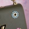Túi Louis Vuitton Twist MM Mechanical Flower Khaki Epi (Limited)