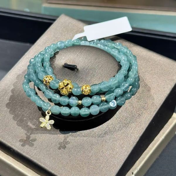 Chuỗi Lam Ngọc Dẹt Cuốn 4 Mix Charm Vàng