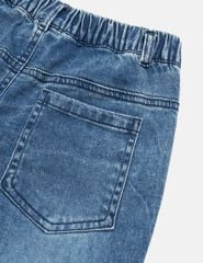 Quần jean ống loe bé gái đính nơ gần gấu quần